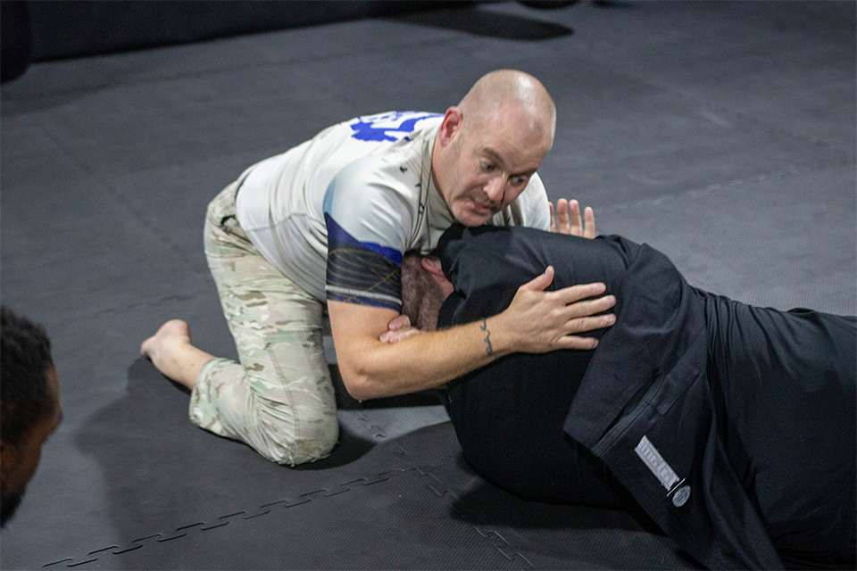 Gareth Jenkins rolling with a BJJ student