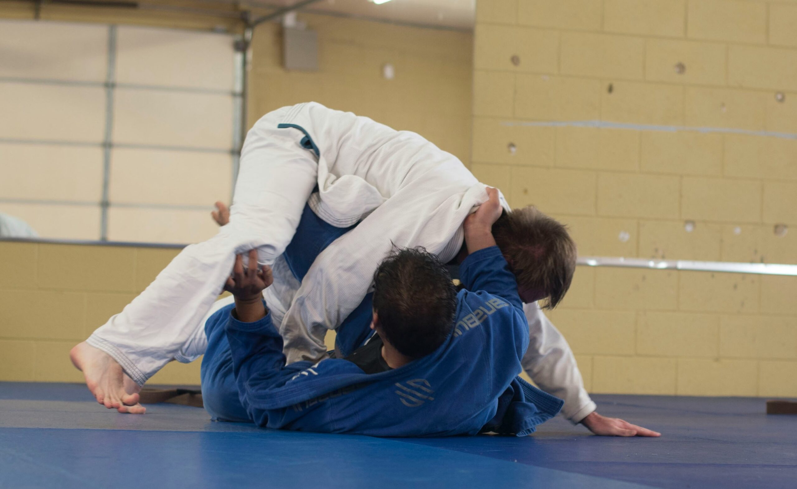 two BJJ Students rolling with each other