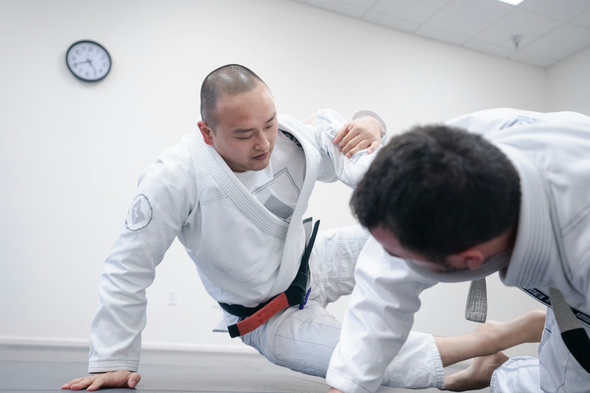 two BJJ Students rolling with each other